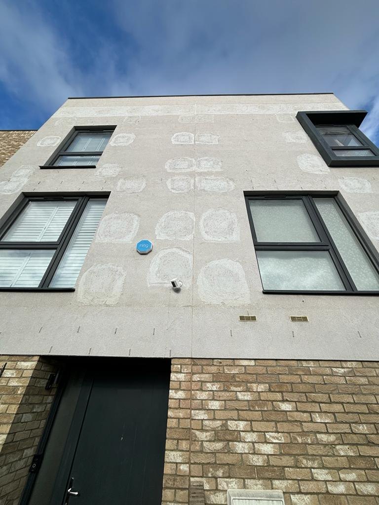 Rendered elevation in Carshalton with made-good investigation openings, part of fire protection investigations for Rydon