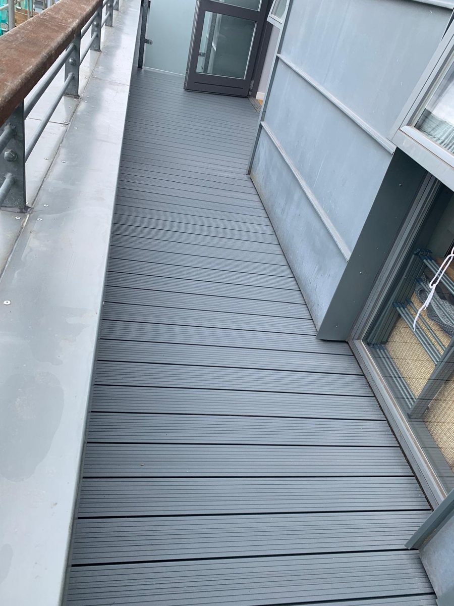 Long run of Alideck aluminium decking on a curved balcony walkway